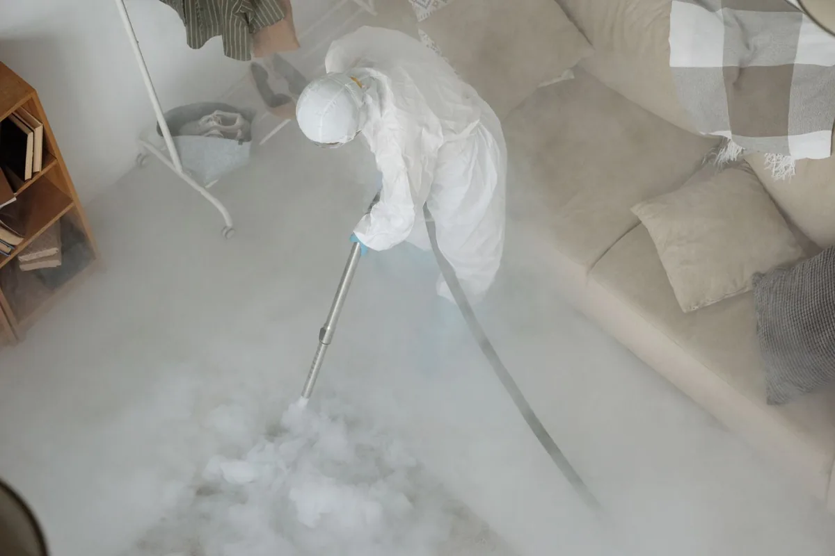 Biohazard cleanup technician in protective equipment, Lackawanna, NY